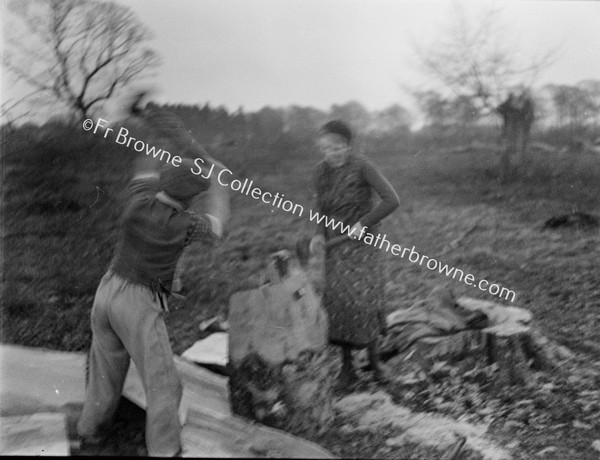 MAN & WOMAN CHOPPING WOOD